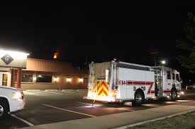 A Fire Truck Is Parked Outside Grandon Funeral Home As A Chimney Fire Burns Thursday Night The Fire Was Caused Fire Trucks Recreational Vehicles Funeral Home