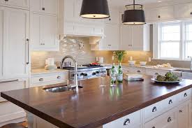 white kitchen island with dark wood