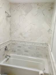 Measure your tub before you buy a tub surround to make sure it fits. Herringbone Patterned Shower With Custom Wrap Around Band Shower Renovation Shower Tile Shower
