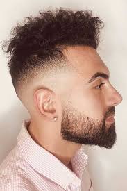 In order to keep things decent, you can have a medium to a high fade which balances the unruly character of curls. Pompadour Fade With Curly Hair Novocom Top
