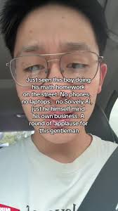 A Boy Studies under A Street Light