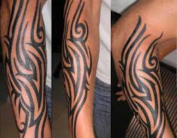 The tribal pattern runs around the upper arm, stretching towards the shoulder, and partially towards the elbow. 21 Tribal Forearm Tattoos