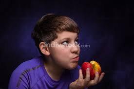 If you have a full mane of dark brown hair, using a purple shampoo won't be particularly effective. White Boy Teenager With Light Brown Hair Dressed In A Purple Sports T Shirt Chews And Holds In His Hand A Large Red And Yellow Apple On An Isolated Background Indivstock
