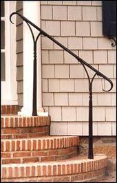 Capture the elegance of a european estate by trimming stone steps with a wrought iron railing, then topping it with a wood handrail stained to match your front door. Architectural Blacksmithing Wroght Iron Railings Gates Handrails Outdoor Stair Railing Wrought Iron Stair Railing Iron Stair Railing