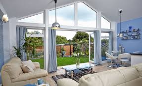 Ultra trade frames can offer you a stunning range of aluminium profiles that are affordable for every client. Extension With Garden View Through Bi Folding Doors By Anglian Home Improvements Myglazing Com