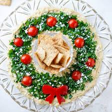 Christmas dinner consists of roast stuffed turkey and ham, mince pies. Easy Christmas Appetizer Hummus Wreath Two Healthy Kitchens