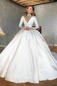 Whether you want a bridal style with simple satin, sheer long sleeves or extravagant beaded lace, these ball gown wedding dresses will make you feel like royalty on your special day. Vintage Satin Winter Wedding Dresses With Sleeves Cheap High Neck Long Sleeve Crystals Retro Ball Gown Bridal Dresses Suzhoufashion