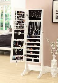 The lotus jewelry armoire is accented by mirrored surfaces, adding depth and shine to room areas. Organize All Your Jewelry With A Cabinet That Also Doubles As A Mirror Jewelry Cabinet Mirror Jewellery Cabinet Armoire Storage