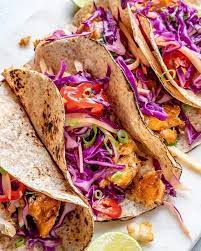 Lay tortilla on a clean and flat surface. Cleanfoodcrush Fish Tacos With Limey Mango Cabbage Slaw Facebook