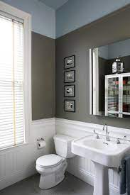 Beadboard wainscoting in the bath contrasting nicely with dark gray walls and a pop of color on the tub. Bathroom Beadboard Ideas Houzz