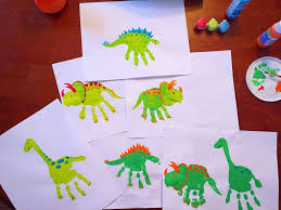 27 insect themed games & activities for preschoolers Dinosaur Handprints Handprint Crafts Crafts Preschool Crafts