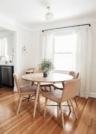 Small dining rooms are often nooks carved out of larger spaces. Baby Friendly Living Dining Room Makeover Kitty Cotten Minimalist Dining Area With Light Oak Round Ki Dining Room Small Dining Room Spaces Oak Dining Chairs