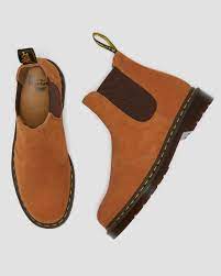 Since its creation in the 1960s, the classic dr martens eight eyelet boot was once an iconic footwear choice for punks, skinheads and today, dr martens has retained its trademark designs but added a fresh, contemporary twist with the addition of coloured soles, soft suedes, bright colours and bold prints. 2976 Suede Chelsea Boots Dr Martens Official