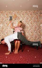 Young woman spanking man hi-res stock photography and images - Alamy