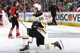 David Pastrnak Of The Boston Bruins Kneels On The Ice During A Break In 2021 Boston Bruins Bruins Chicago Blackhawks