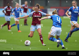 Aston Villa's Ramona Petzelberger (left) celebrates with team-mate Chloe  Arthur after scoring her side's second goal of the game during the FA  Women's Super League match at the People's Pension Stadium, Crawley