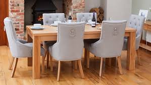 Set of contemporary upholstered dining chairs. Baumhaus Mobel Oak Extending Dining Table And 6 Accent Grey Fabric Dining Chairs Cfs Furniture Uk