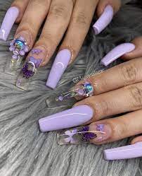 If you want to create an enchanting look for your nails, check out this gorgeous blend of purple and butterfly prints. Purple Butterfly Nails Purple Acrylic Nails Coffin Nails Long Long Acrylic Nails Coffin