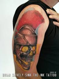 shoulder skull helmet tattoo by sink