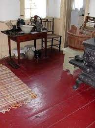 A dining area is defined by painting hardwood floors in color stripes. Painted Floors Painted Wood Floors Painted Floors Painted Floor