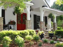 1990s house with maroon shutters and bay window. 20 Front Door Shutter Color Combos We Love Hgtv