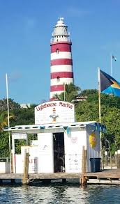 Lighthouse Marina At The Base Of The Historic Elbow Reef Light House In Picturesque Hope Town Harbour Abaco Lighthouse Lighthouse Inspiration Reef Lighting