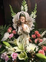 We will help you express your sorrow with sympathy flowers. Kneeling Angel Arrangement Sympathy Arrangement Funeral Flowers In Mckees Rocks Pa The Bloomin Bar By Muetzel S Florist
