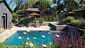 Why We Love It A Bordering Wall Of Dry Stacked Pennsylvania Fieldstone Brings Rustic Charm And Visual Interest To Pool Houses Patio Entertaining Tiny Cottage