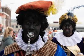 Many dutch people dress up as zwarte piet — which literally translates to black pete — to celebrate the holiday by donning a curly wig, big gold earrings, red lips, and blackface. Dutch Activists Protest Blackface Christmas Character Black Pete South China Morning Post