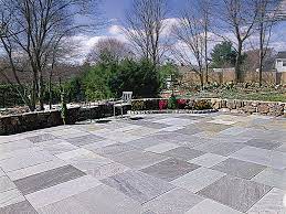 Variations in stone color, sizes and shape create depth and character for the patio design. How To Lay A Stone Patio This Old House