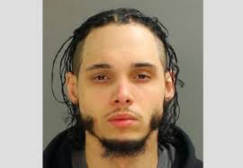 2 guns, 1 stolen, & drugs found in man's SUV: Police