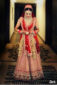 Sabyasachi Red And Gold Bridal Outfit Indian Wedding Lehenga Indian Bridal Fashion Top Wedding Dress Designers Bridal Outfits