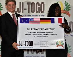 From the left to the right side we have the. The Deputy Chief Of Mission Of The Us Embassy Giving Her Symbolic Ticket To The 1st Of The Radio Category U S Embassy In Togo