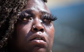 Police hit man in face