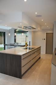 Kuhlmann Gloss Cashmere Kitchen With Dark Wood Panels Dropped Ceiling With Best Ceiling Extracto Kitchen Ceiling Design Luxury Kitchen Design Kitchen Ceiling
