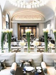 Dining Room White Sofas Tables Long Stemmed Flowers Under Dome Ceilings Chandeliers Luxury Hotels Paris Hotel Interior Design Restaurant Paris Interiors