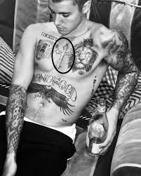 Cross chest tattoo with 3d elements. Justin Bieber S 60 Tattoos Their Meanings Body Art Guru