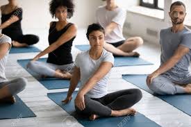 Check spelling or type a new query. Indian Ethnicity Woman With Group Of Multinational People Seated In Lotus Pose Performing Easy Twist Pose Or Parivrtta Sukhasana At Morning Yoga Routine In Sport Club Studio Healthy Lifestyle Concept Stock Photo