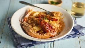 Añadir el arroz y remover. Paella De Marisco Nestle Cocina