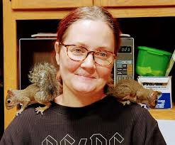 Bob Ross with his pet squirrels, 1991