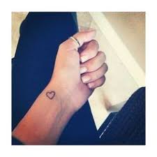 Colorful heart tattoo on wrist. 10 Small Heart Wrist Tattoo Ideas Heart Tattoo Tiny Tattoos Mini Tattoos