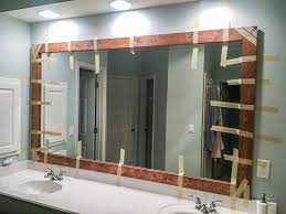 How To Diy Upgrade Your Bathroom Mirror With A Stained Wood Frame Building Our Rez In 2020 Wood Framed Bathroom Mirrors Bathroom Mirrors Diy Bathroom Makeover