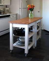 Combine a kitchen island with shelves to create a rustic kitchen where you can cook together. Ikea Hack Two Plain Little Kitchen Islands Painted And Re Stained I Needed A Long Narrow Isl Ikea Kitchen Island Kitchen Hacks Design Kitchen Cabinet Design