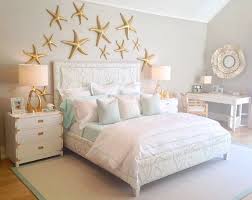 Beach Theme Bedroom Decor Under The Sea Themed Bedroom With A Coral Print Upholstered Bed U0026 Gold Sta Ocean Decor Bedroom Bedroom Turquoise Coastal Bedrooms
