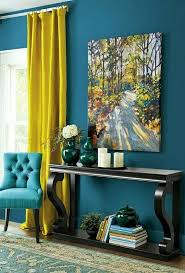 Home Decor Featuring Teal Walls And Mustard Curtains An Upholstered Chair Oak Table And Wall Art Finish Living Room Color Living Room Decor Room Paint Colors