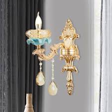 Their black frames for wall mounting are durable and neutral, so they match any home design. Amber Crystal Candle Wall Lamp Modern 1 2 Bulb Bedroom Wall Sconce In Gold With Carved Arm Beautifulhalo Com