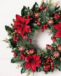 Onene 2 pack christmas poinsettia garland artificial christmas flowers decorations with holly leaves chain and red berries for christmas party holiday indoor and outdoor wreath decor, total 13.2 ft. Outdoor Festive Poinsettia Wreath By Balsam Hill Christmas Wreaths Diy Christmas Wreaths Artificial Christmas Wreaths