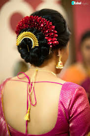 Gajra hairstyle as traditional bun: What A Beautiful Large Low Bun With Gajra Juda Pun Care However Should Be Taken Before Adopt Indian Bridal Hairstyles Bridal Hair Buns Indian Bun Hairstyles