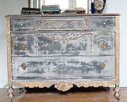 A distressed finish is essentially achieved by painting a wooden kitchen or piece of i have seen a piece of painted furniture that is distressed teal colour, with gold underneath. Black And Gold Distressed Dresser Hometalk