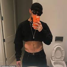 This is rambo's brother, eddy. Bad Bunny Puts His Abs On Display In A Black Crop Top With New Thirst Trap Selfie Daily Mail Online